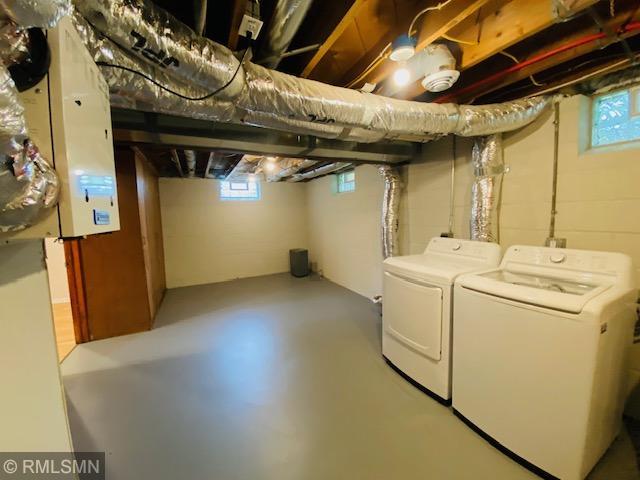 6007 Vincent Ave N, Brooklyn Center, MN 55430 - basement with washing machine and dryer, plenty of natural light, and concrete block wall