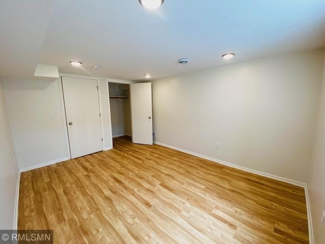6007 Vincent Ave N, Brooklyn Center, MN 55430 - unfurnished bedroom featuring light wood finished floors, a closet, and recessed lighting