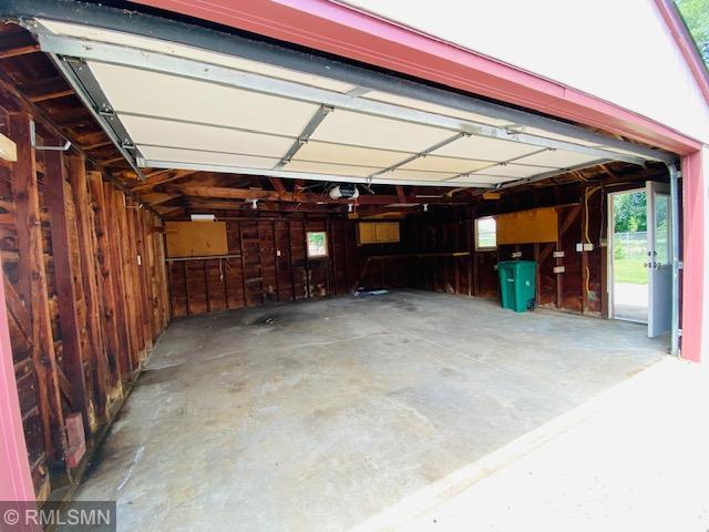 6007 Vincent Ave N, Brooklyn Center, MN 55430 - garage featuring a garage door opener