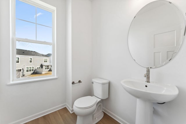 2700 Kepler Ave NE, Saint Michael, MN 55376 - half bathroom featuring baseboards and wood finished floors