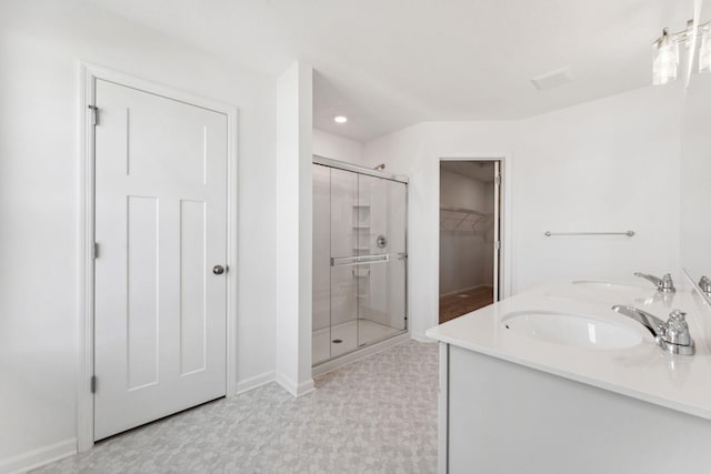 2700 Kepler Ave NE, Saint Michael, MN 55376 - full bathroom featuring a stall shower, a walk in closet, double vanity, tile patterned floors, and recessed lighting