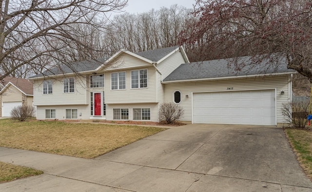 3415 Lake St NW, Rochester, MN 55901 - raised ranch with a front yard, concrete driveway, and a garage