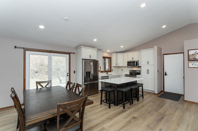 3415 Lake St NW, Rochester, MN 55901 - dining area with vaulted ceiling, light wood finished floors, and recessed lighting