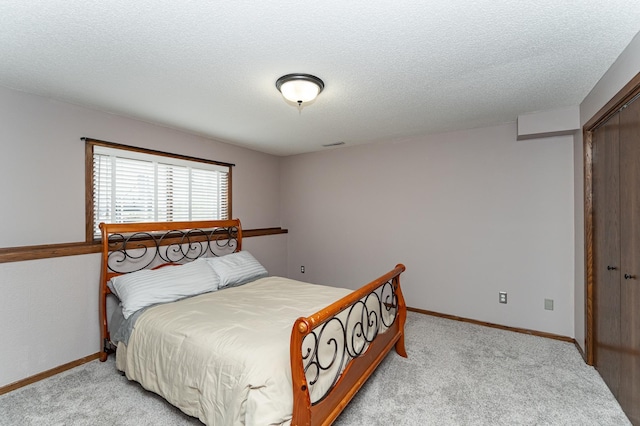 3415 Lake St NW, Rochester, MN 55901 - bedroom with light carpet and a textured ceiling