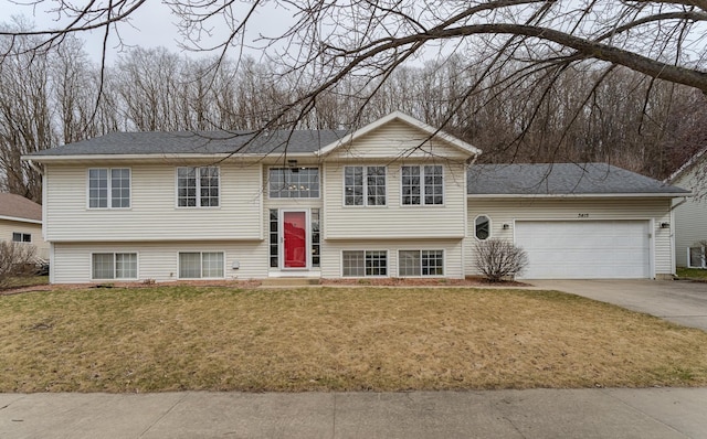 3415 Lake St NW, Rochester, MN 55901 - bi-level home featuring a garage, concrete driveway, and a front yard