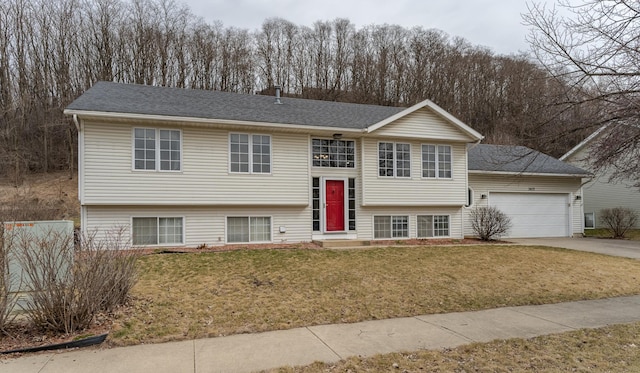 3415 Lake St NW, Rochester, MN 55901 - raised ranch with a garage, a front yard, concrete driveway, and roof with shingles