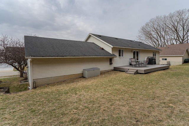 3415 Lake St NW, Rochester, MN 55901 - rear view of house featuring a wooden deck, a yard, and a shingled roof