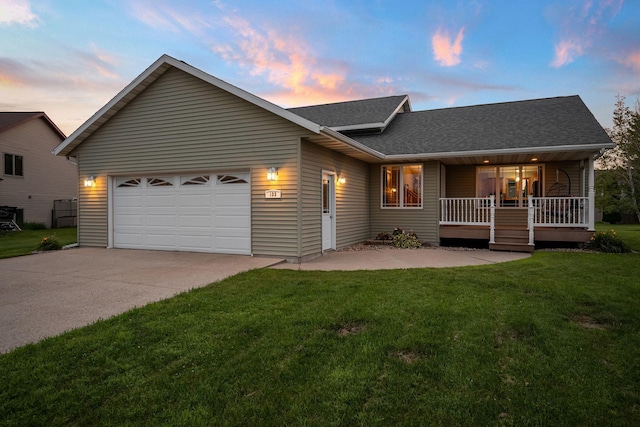 133 Uriah Ct, Mankato, MN 56001 - view of front of home featuring an attached garage, covered porch, a shingled roof, a front yard, and concrete driveway