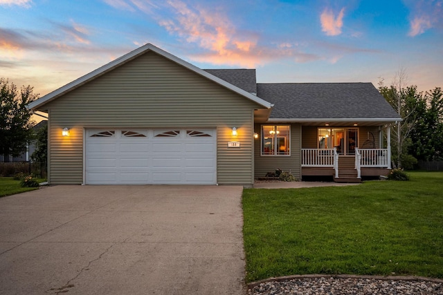 133 Uriah Ct, Mankato, MN 56001 - view of front of home featuring covered porch, driveway, a yard, a garage, and roof with shingles