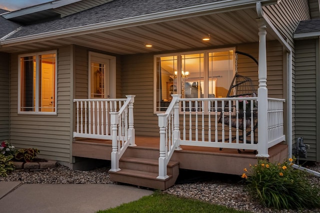 133 Uriah Ct, Mankato, MN 56001 - doorway to property featuring a shingled roof and a porch