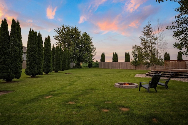 133 Uriah Ct, Mankato, MN 56001 - yard at dusk with an outdoor fire pit and a deck