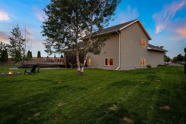 133 Uriah Ct, Mankato, MN 56001 - view of home's exterior featuring a fire pit, a deck, and a yard