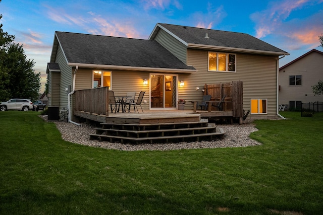 133 Uriah Ct, Mankato, MN 56001 - back of house with a lawn, a wooden deck, and a shingled roof
