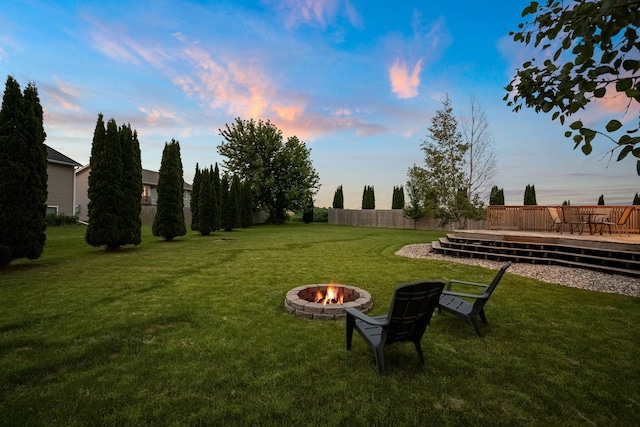 133 Uriah Ct, Mankato, MN 56001 - view of green lawn featuring an outdoor fire pit and a wooden deck
