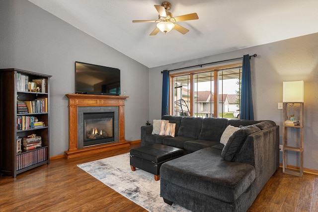 133 Uriah Ct, Mankato, MN 56001 - living area with vaulted ceiling, wood finished floors, ceiling fan, and a glass covered fireplace