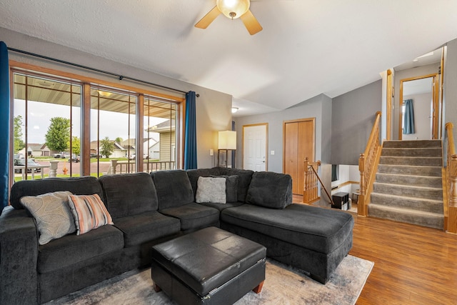 133 Uriah Ct, Mankato, MN 56001 - living room featuring wood finished floors, a ceiling fan, vaulted ceiling, and stairway