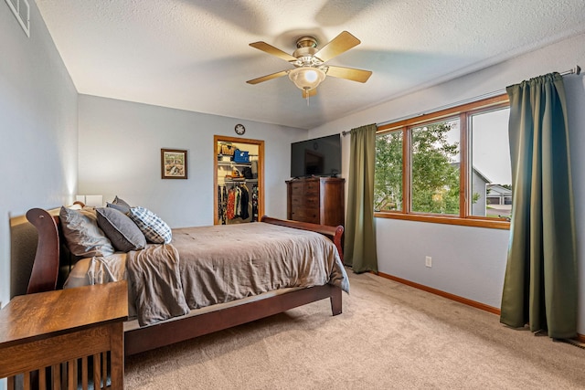 133 Uriah Ct, Mankato, MN 56001 - bedroom with carpet, a spacious closet, a ceiling fan, and a textured ceiling