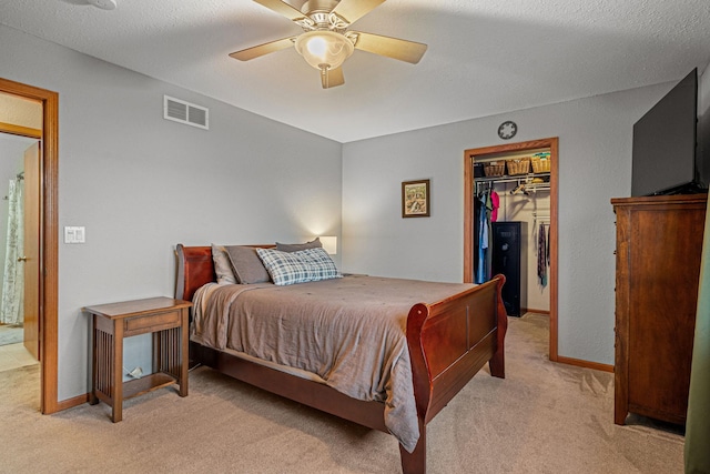 133 Uriah Ct, Mankato, MN 56001 - bedroom featuring light colored carpet, a walk in closet, and a ceiling fan