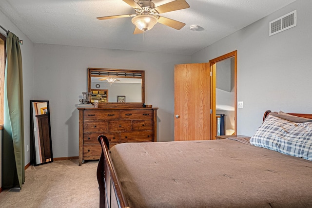 133 Uriah Ct, Mankato, MN 56001 - bedroom with light colored carpet, a ceiling fan, and a textured ceiling