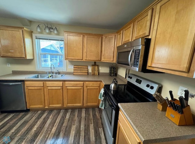 319 13th St N, Moorhead, MN 56560 - kitchen featuring stainless steel appliances and dark wood-type flooring