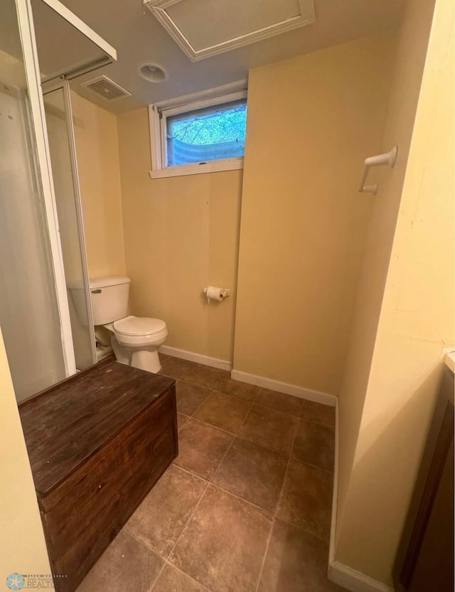 319 13th St N, Moorhead, MN 56560 - bathroom featuring a stall shower and tile patterned flooring