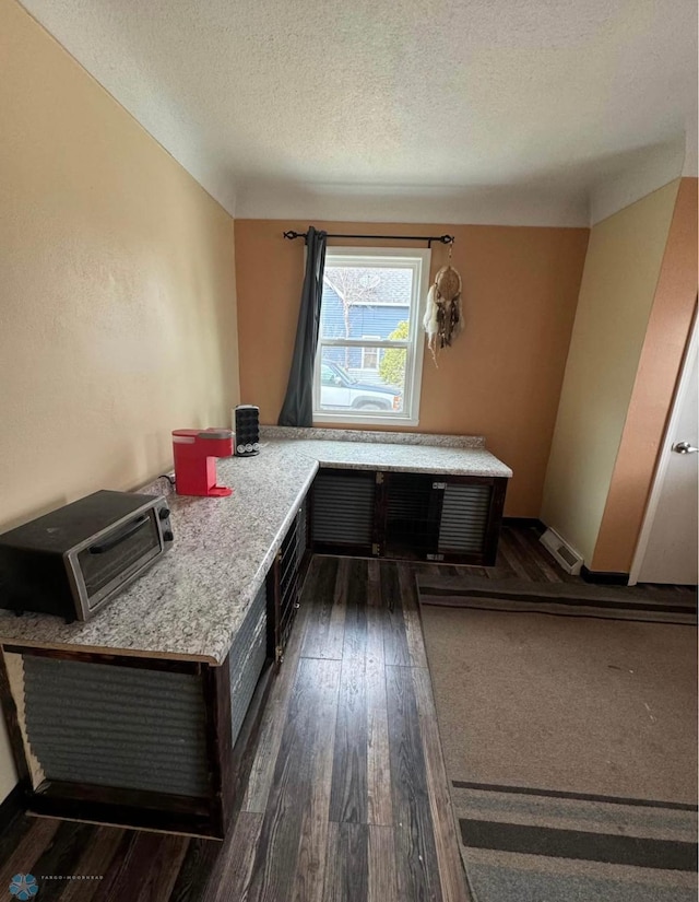 319 13th St N, Moorhead, MN 56560 - office area featuring dark wood finished floors and a textured ceiling