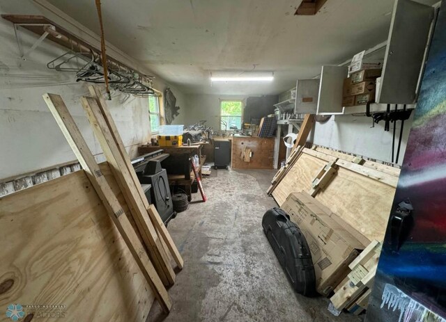 319 13th St N, Moorhead, MN 56560 - misc room with concrete flooring and a workshop area