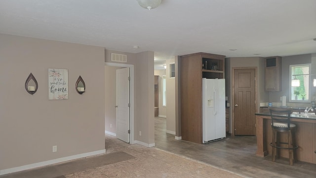 4247 Crow Wing Cir SW, Sylvan Twp, MN 56473 - unfurnished living room featuring baseboards and a sink