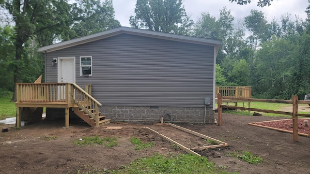4247 Crow Wing Cir SW, Sylvan Twp, MN 56473 - rear view of house featuring crawl space and a wooden deck