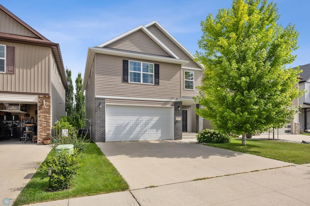 5543 Tuscan Ct S, Fargo, ND 58104 - traditional home with an attached garage, brick siding, and driveway