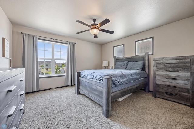 5543 Tuscan Ct S, Fargo, ND 58104 - carpeted bedroom with a ceiling fan