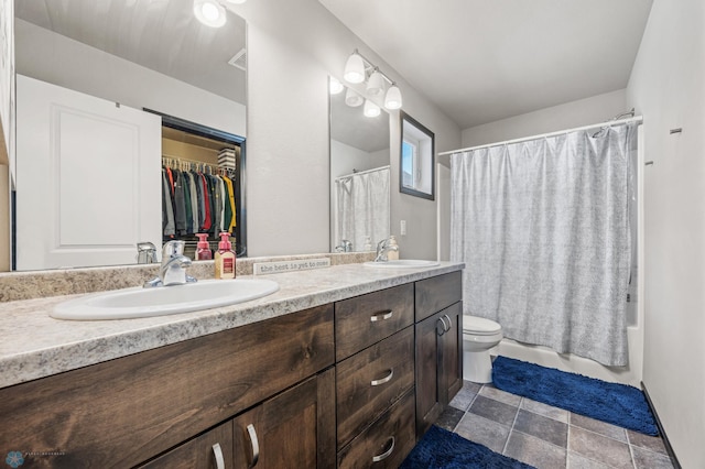 5543 Tuscan Ct S, Fargo, ND 58104 - bathroom featuring double vanity, shower / bath combo, and stone finish floors