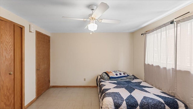 806 8th St SW, Willmar, MN 56201 - bedroom featuring light flooring, ceiling fan, and multiple closets