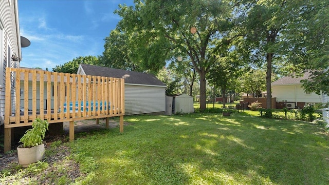 806 8th St SW, Willmar, MN 56201 - view of yard with a storage shed and a wooden deck