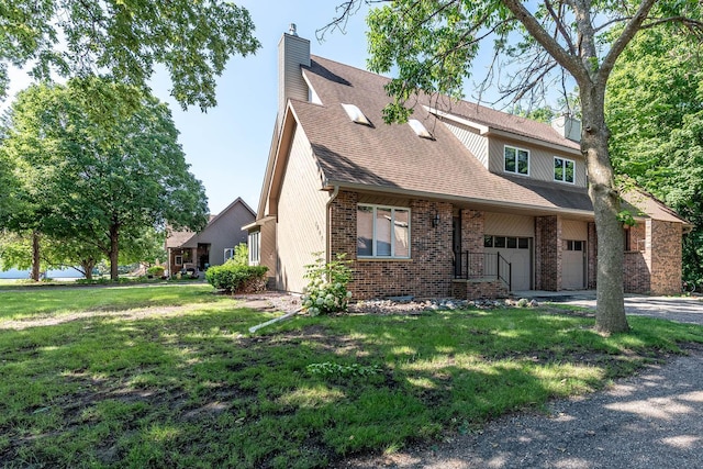 1607 Pleasant View Dr, North Mankato, MN 56003 - view of front of property featuring a chimney, brick siding, driveway, and an attached garage