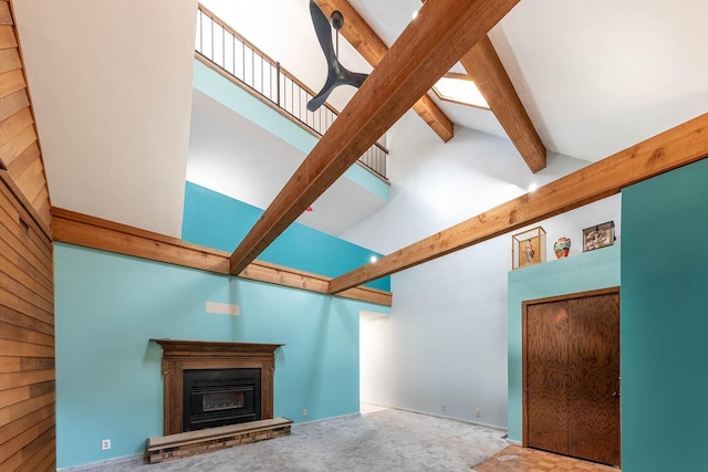 1607 Pleasant View Dr, North Mankato, MN 56003 - unfurnished living room featuring a glass covered fireplace and carpet floors