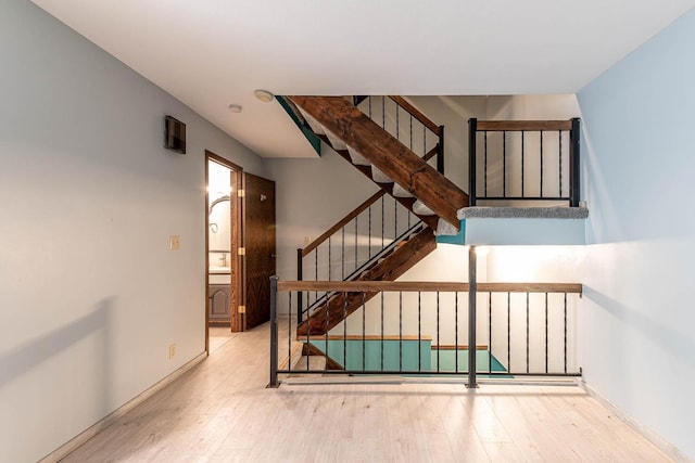 1607 Pleasant View Dr, North Mankato, MN 56003 - stairway featuring wood finished floors and baseboards
