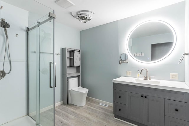 1607 Pleasant View Dr, North Mankato, MN 56003 - full bath with a stall shower, wood finished floors, and vanity