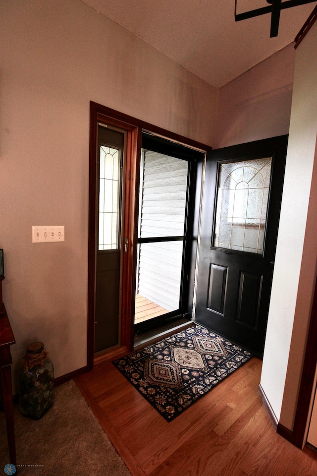 1307 Libra Ln, Fargo, ND 58104 - foyer with vaulted ceiling, wood finished floors, and ceiling fan