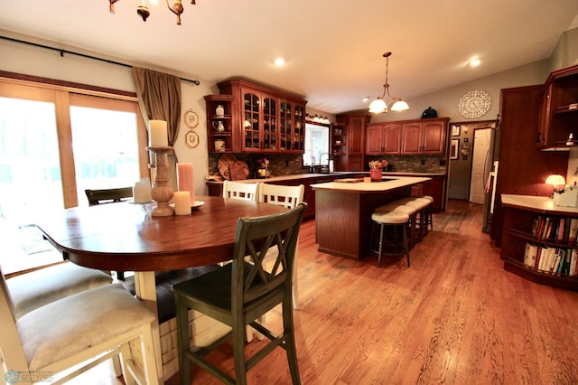 1307 Libra Ln, Fargo, ND 58104 - dining space with light wood-type flooring, a chandelier, and recessed lighting