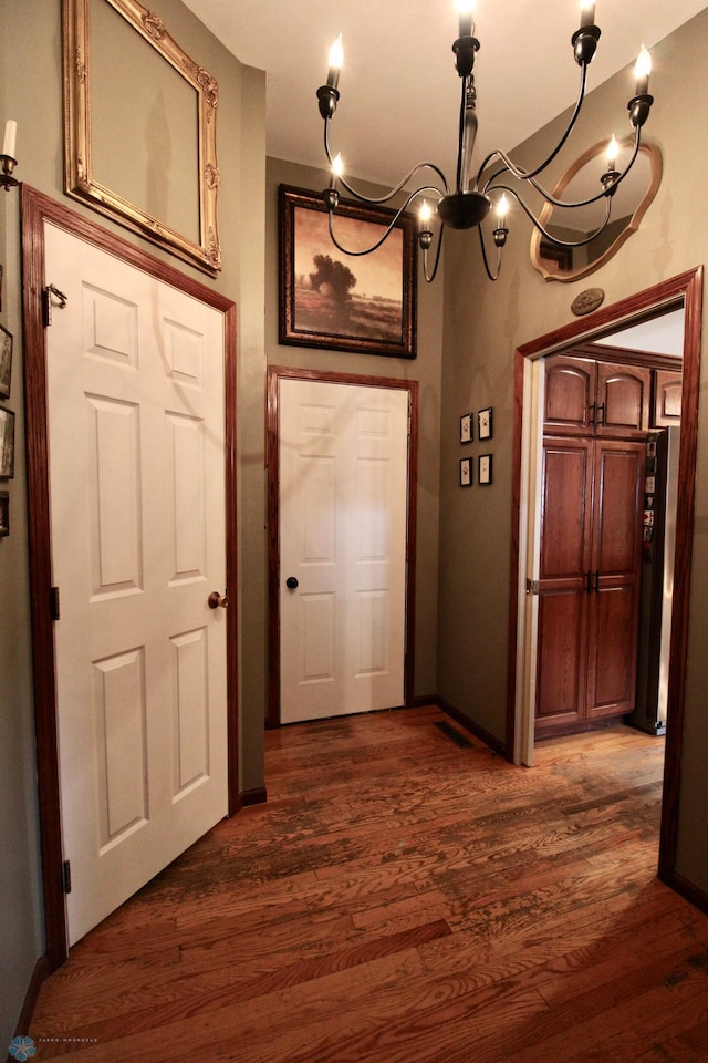 1307 Libra Ln, Fargo, ND 58104 - foyer entrance with dark wood-style floors and a chandelier