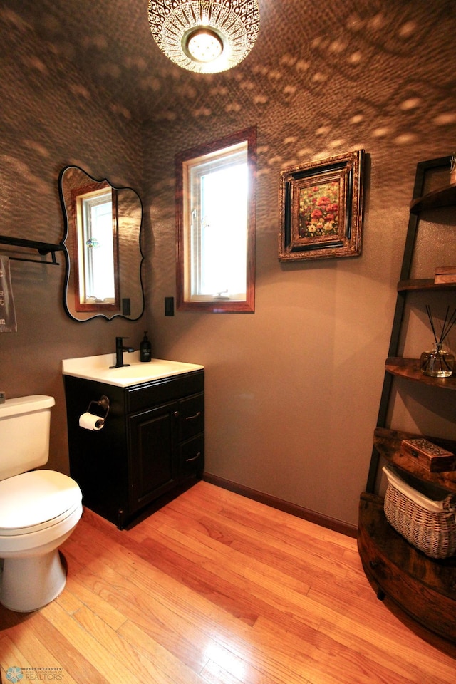 1307 Libra Ln, Fargo, ND 58104 - bathroom with vanity and wood finished floors
