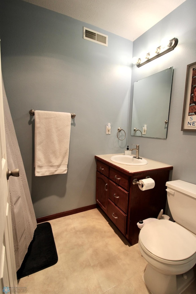 1307 Libra Ln, Fargo, ND 58104 - bathroom featuring vanity and toilet