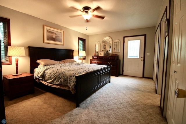 1307 Libra Ln, Fargo, ND 58104 - bedroom featuring light carpet and ceiling fan