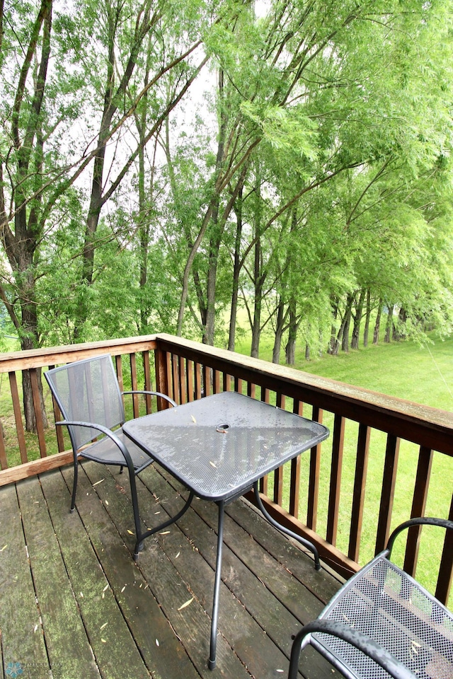 1307 Libra Ln, Fargo, ND 58104 - deck with outdoor dining area and a lawn