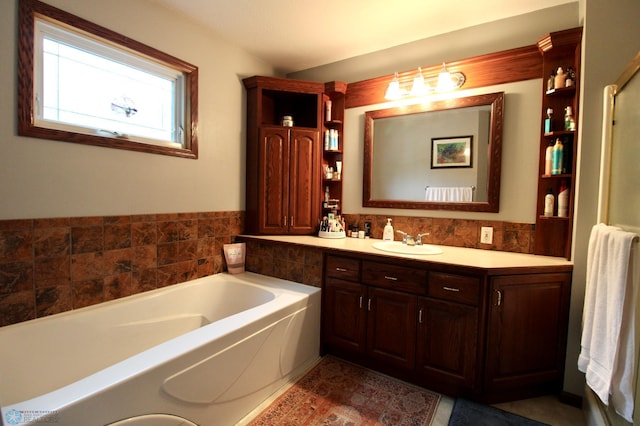 1307 Libra Ln, Fargo, ND 58104 - bathroom featuring vanity and a garden tub