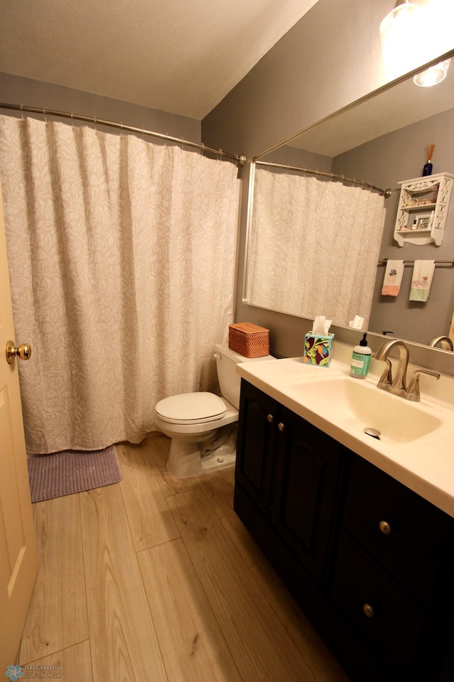 1307 Libra Ln, Fargo, ND 58104 - bathroom featuring wood finished floors and vanity