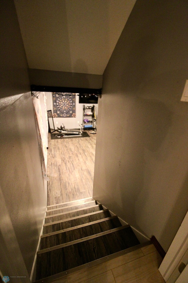 1307 Libra Ln, Fargo, ND 58104 - stairway with wood finished floors and vaulted ceiling