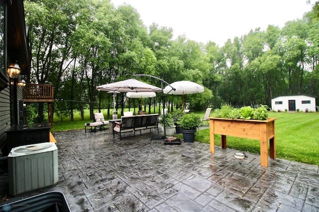 1307 Libra Ln, Fargo, ND 58104 - view of patio with an outdoor structure and view of scattered trees