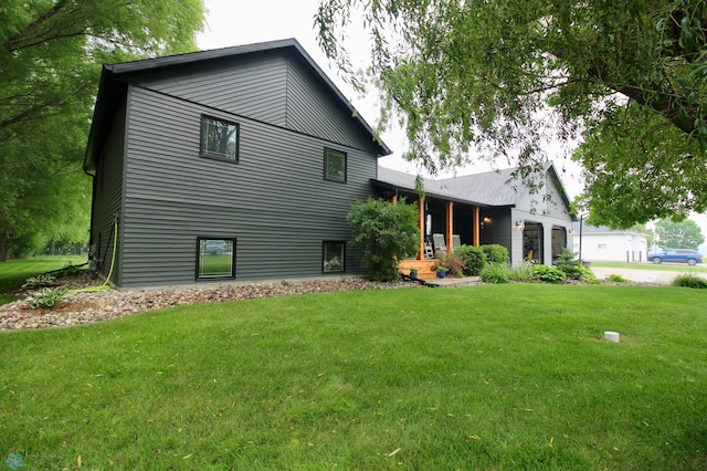 1307 Libra Ln, Fargo, ND 58104 - back of house with a lawn, an attached garage, and driveway